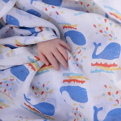 Rainbow bright unisex whale organic swaddle by Piccalilly