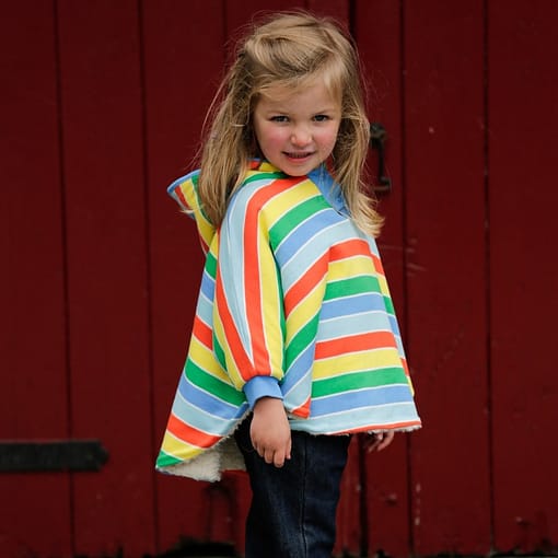 Primary stripe rainbow reversible poncho by Piccalilly in organic cotton - Image 2